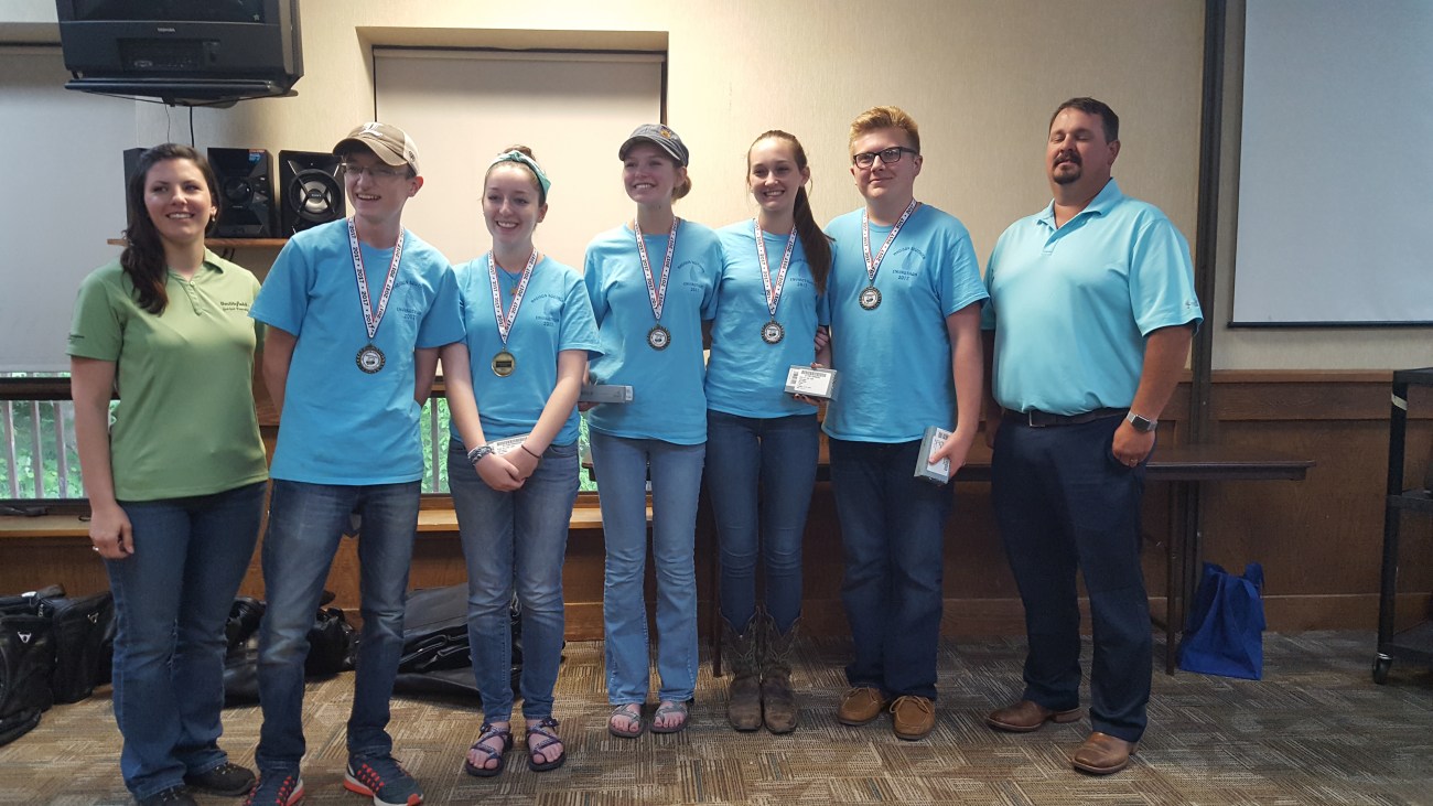 From left to right: Dorothy Anglin of Smithfield Foods poses with the Madison Southern FFA team, Seth Anderson, Callie Anderson, Lauren Rowlette, Carly Mays, Ty Allen and Jeremy Roy of the Kentucky Farm Bureau Federation . Photo by Dale Booth.