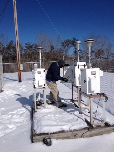 Jeff Patton works on the snowy deck with an air monitor. Photo by Joe Boggs.