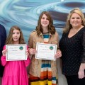 Anna Carwile (center) receives her award.