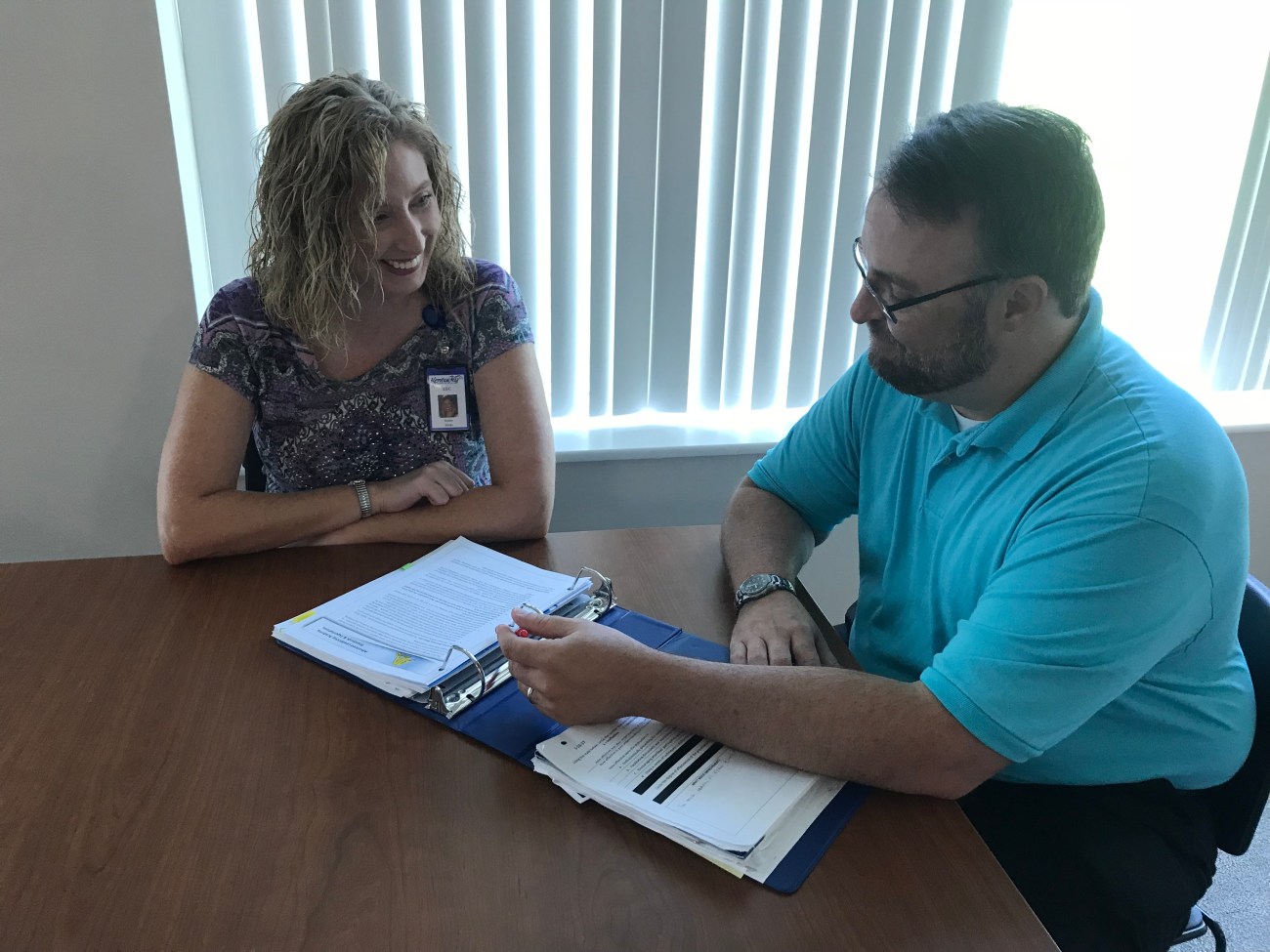 Mark Kennedy talks with TBD employee, Kristy Hicks.