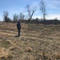 Ben Enzweiler manually lands the drone at a site.