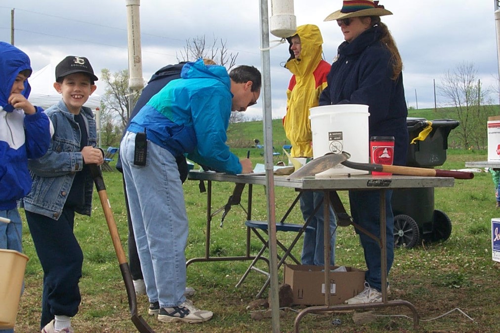 A family signs up to plant trees at Masterson Station in 2001.