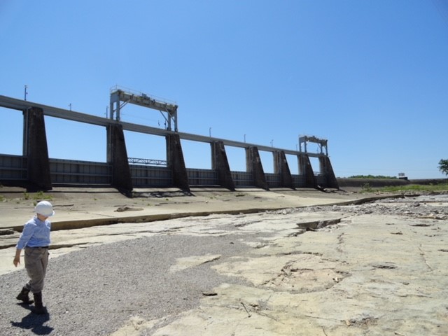 Marilyn onsite inspecting a dam.