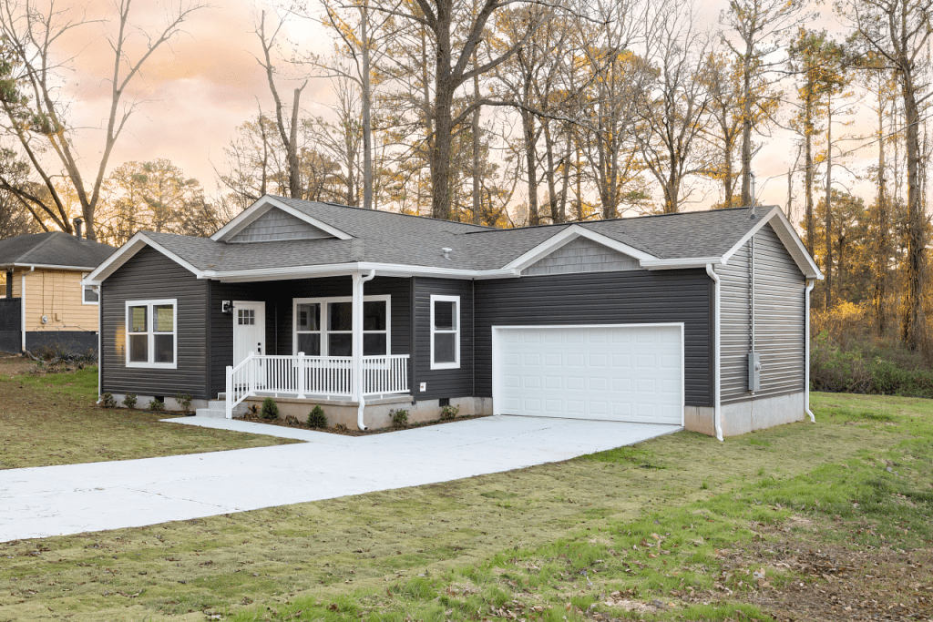 Photo of manufactured home (photo courtesy of Clayton) with gray siding. 
